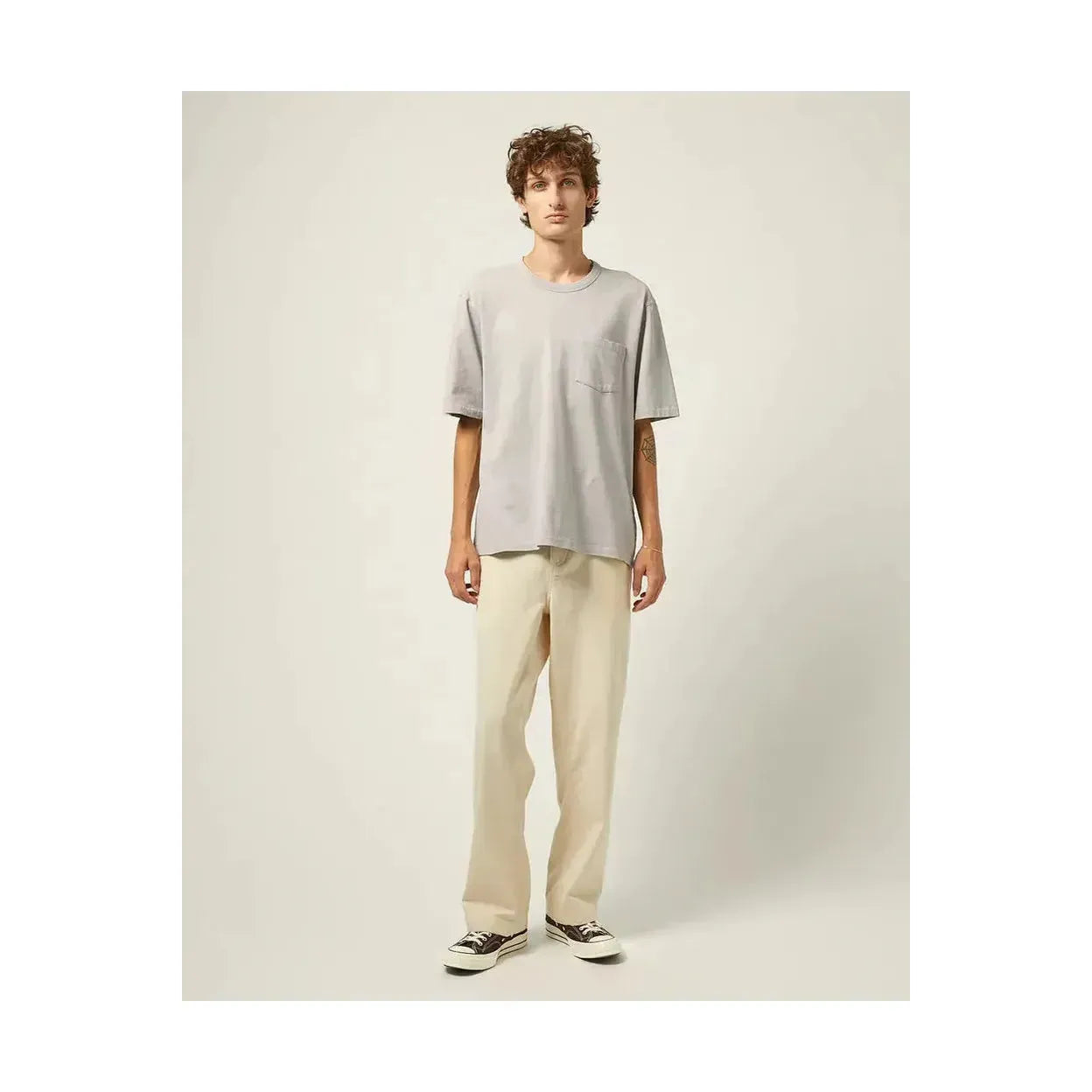 Men's garment dyed tee in oyster grey by Corridor, showcasing the soft fabric and relaxed fit on a neutral background.