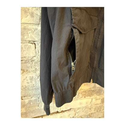 Men's smokey blue cotton bomber jacket by Closed Men's, shown on a hanger with front zipper and ribbed cuffs.