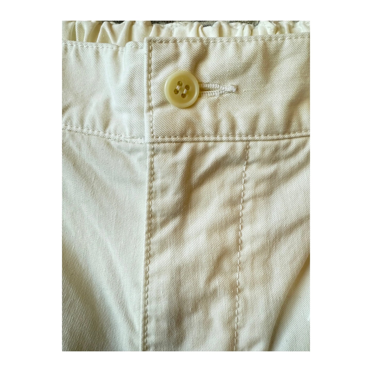 Off white men's cotton chino cloth peg top pants by Sage De Cret, showing the relaxed fit and high-quality fabric.