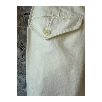 Men's off-white cotton chino cloth peg top pants by Sage De Cret, featuring a relaxed fit and classic style.