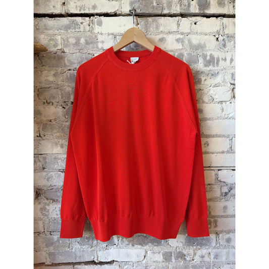 Men's orange cotton crewneck sweater by Aspesi, featuring a close-up of the soft fabric and classic fit.