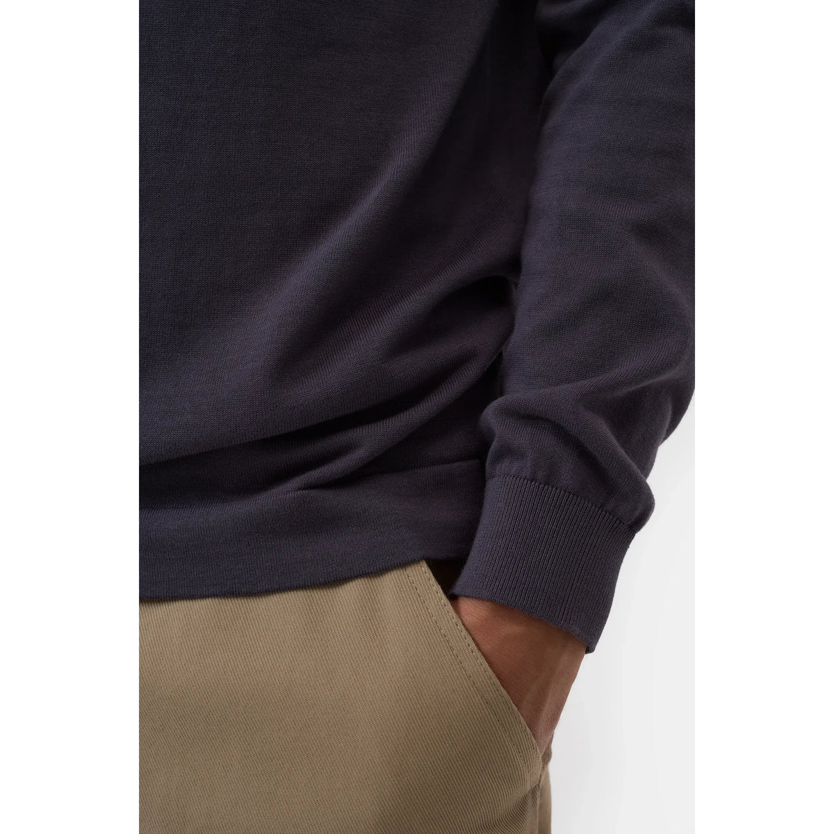 Men's cotton jumper in Magma Black by Closed Men's, showing a close-up of the black knit fabric and ribbed collar.