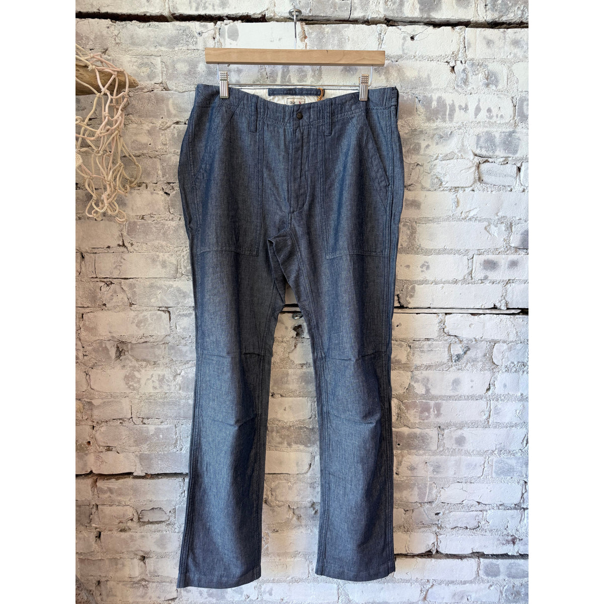 Men's cotton and linen supply pants in indigo yarn-dye by Relwen, showing the relaxed fit and textured fabric.