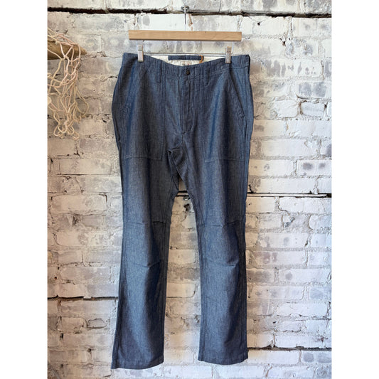Men's cotton and linen supply pants in indigo yarn-dye by Relwen, showing the relaxed fit and textured fabric.