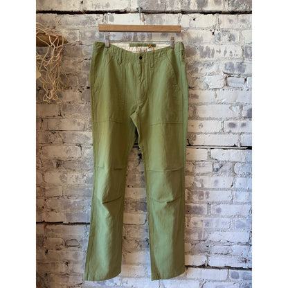 Men's cotton and linen supply pant in light olive by Relwen, featuring a relaxed fit and casual style.