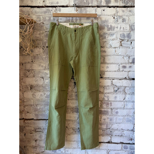 Men's cotton and linen supply pant in light olive by Relwen, featuring a relaxed fit and casual style.