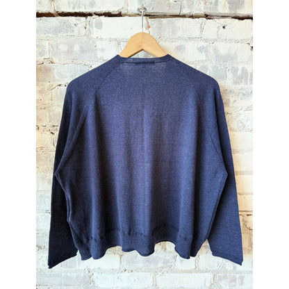 Women's navy cotton-linen V-neck cardigan sweater by Pas De Calais, displayed flat showing front detail and relaxed fit.