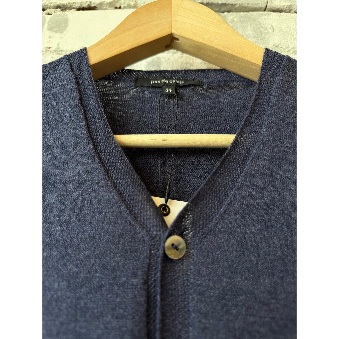 Women's navy cotton-linen V-neck cardigan sweater by Pas De Calais, showing the front with a relaxed fit and soft fabric.