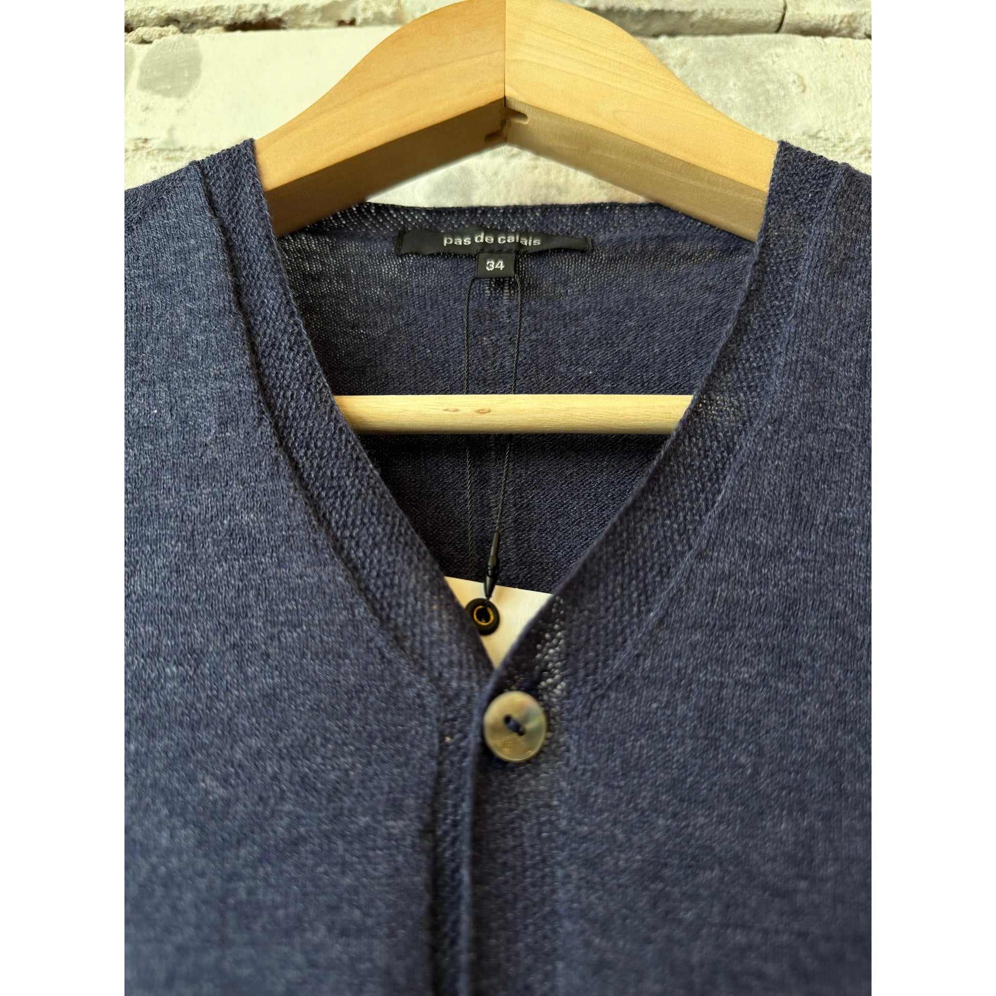 Women's navy cotton-linen V-neck cardigan sweater by Pas De Calais, showing the front with a relaxed fit and soft fabric.