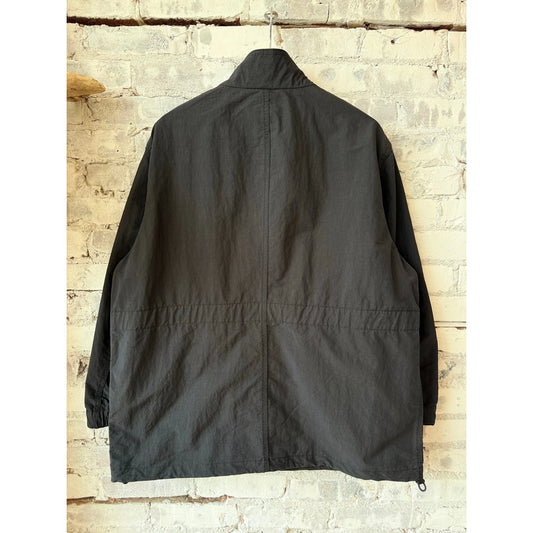 Men's black shirt jacket with stand collar, made of cotton and nylon by Sage De Cret, featuring a stylish typewriter-inspired design.