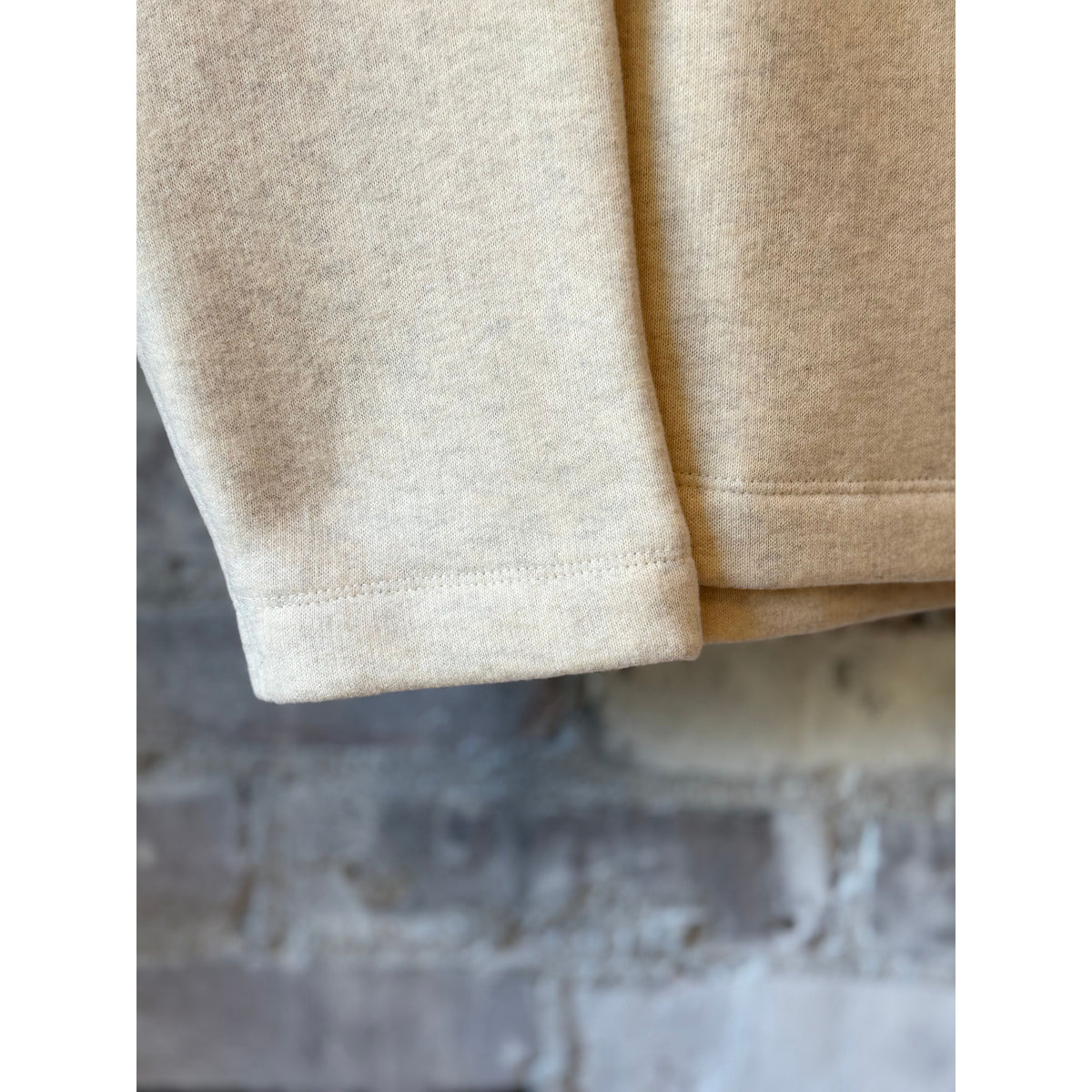Women's oversized oatmeal turtleneck sweater made of cotton and Tencel brushed fleece by V::Room, with a relaxed fit and cozy texture.