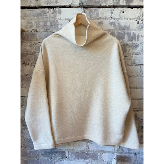 Women's oversized oatmeal turtleneck sweater by V::Room, made of soft cotton Tencel brushed fleece fabric.