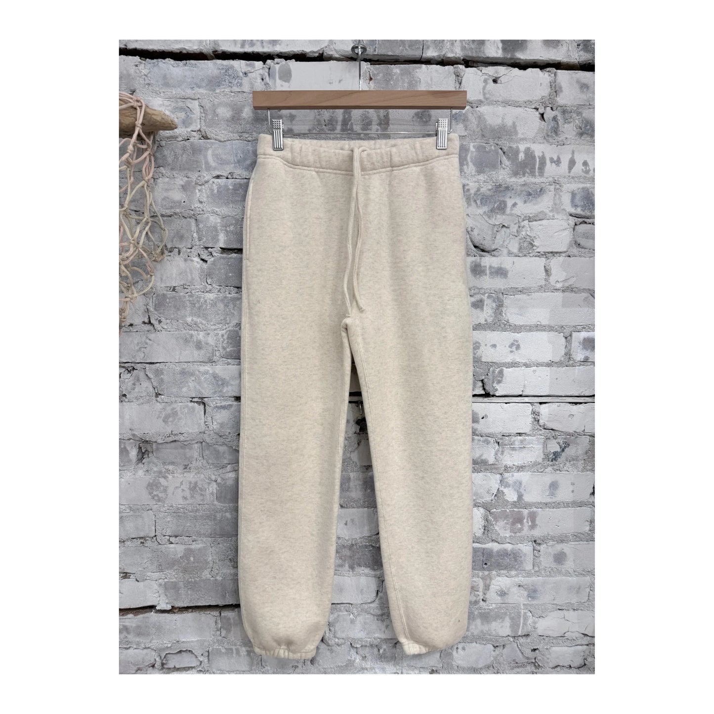 Men's V::Room Cotton Tencel brushed fleece sweatpants in oat color, showing a relaxed fit and soft fabric texture.