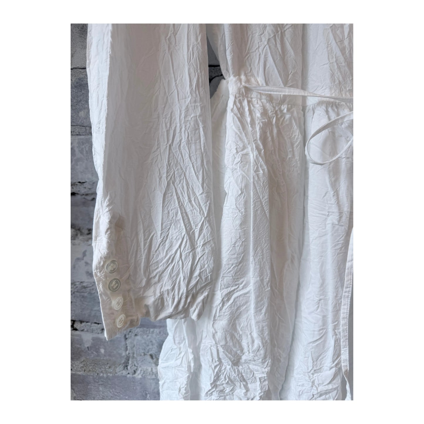 Women's white cotton typewriter dress by Pas De Calais, featuring a classic fitted silhouette and button-down front.