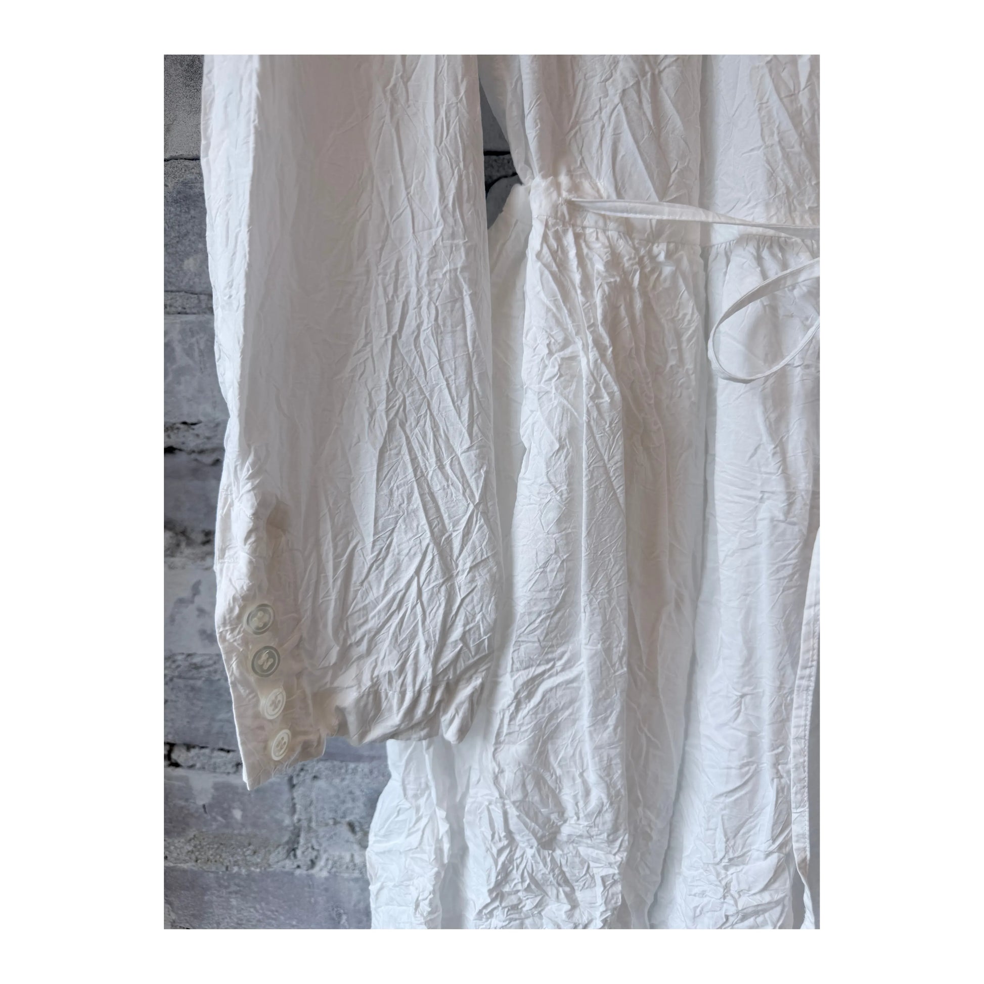 Women's white cotton typewriter dress by Pas De Calais, featuring a classic fitted silhouette and button-down front.