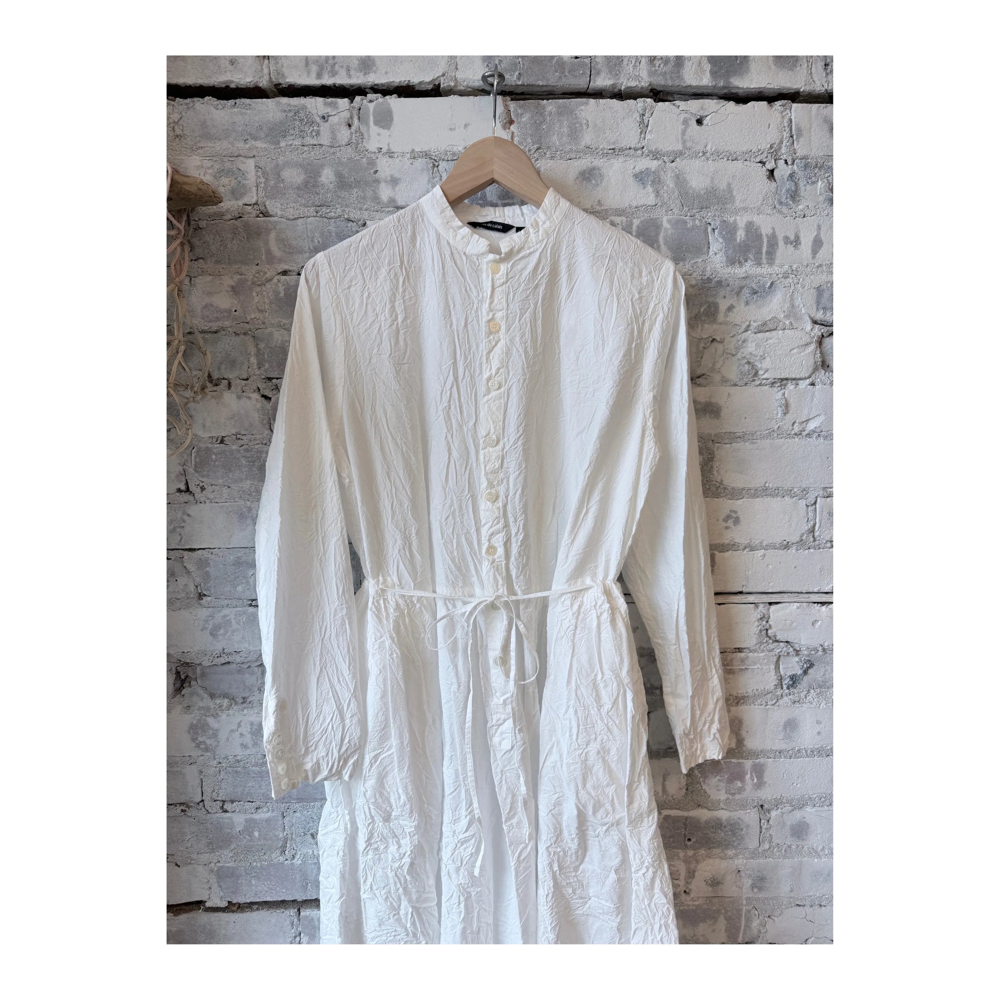 White women's Cotton Typewriter Dress by Pas De Calais, showing the dress's fitted bodice and classic style on a model.