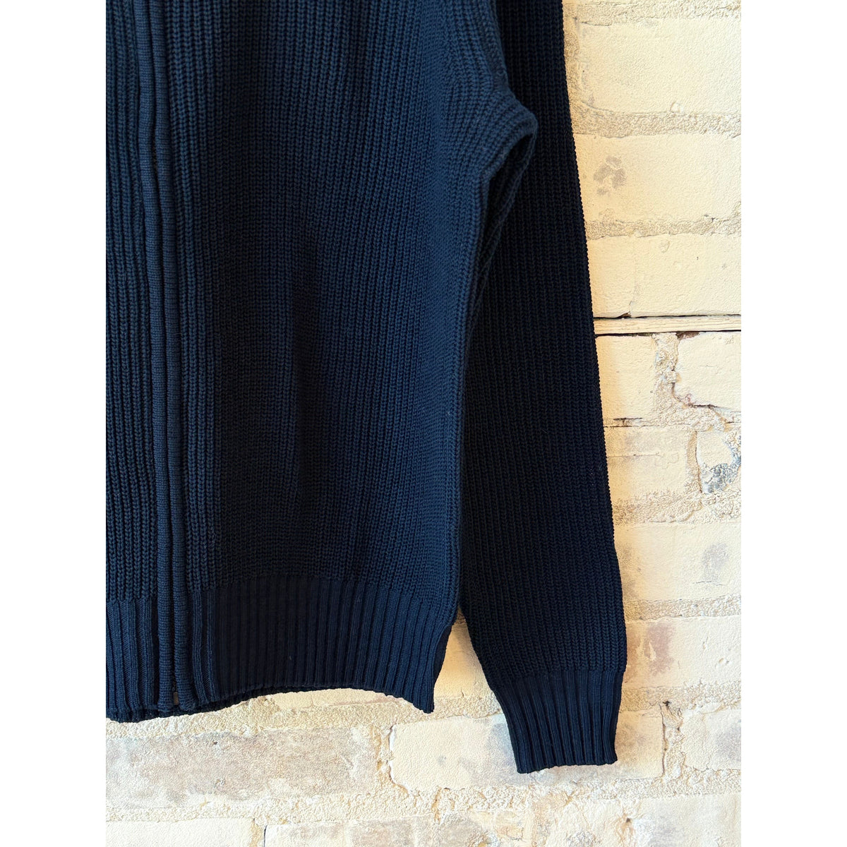 Men's navy Cotton-Yarn Zip Up Sweater by Aspesi, featuring a front zipper and ribbed cuffs, displayed on a hanger.
