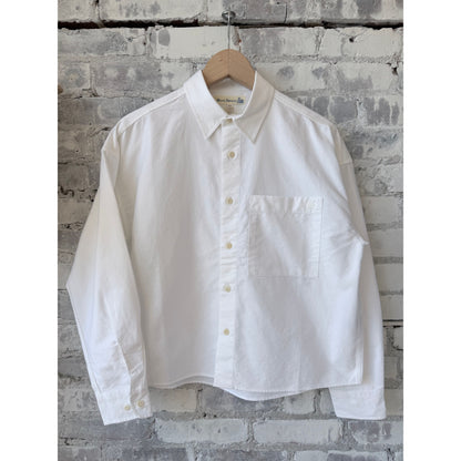 Women's white Cropped Boxy Cotton Oxford Long Sleeve Shirt by Merz B. Schwanen, shown laid flat with collar and button details.