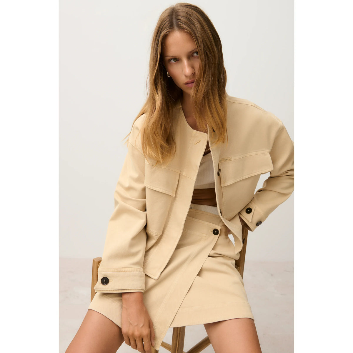 Women's cropped utility jacket in camel beige by Closed, featuring functional pockets and a stylish, modern design.