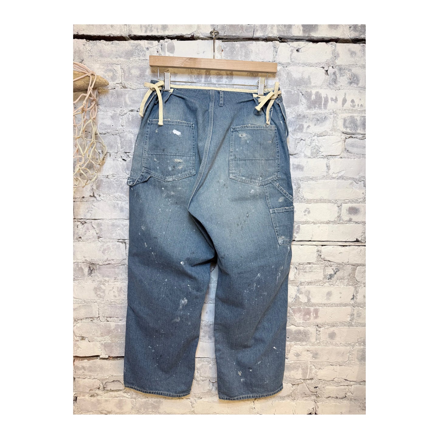 Men's customized side open panther denim pants with unique design details by H-Unit.