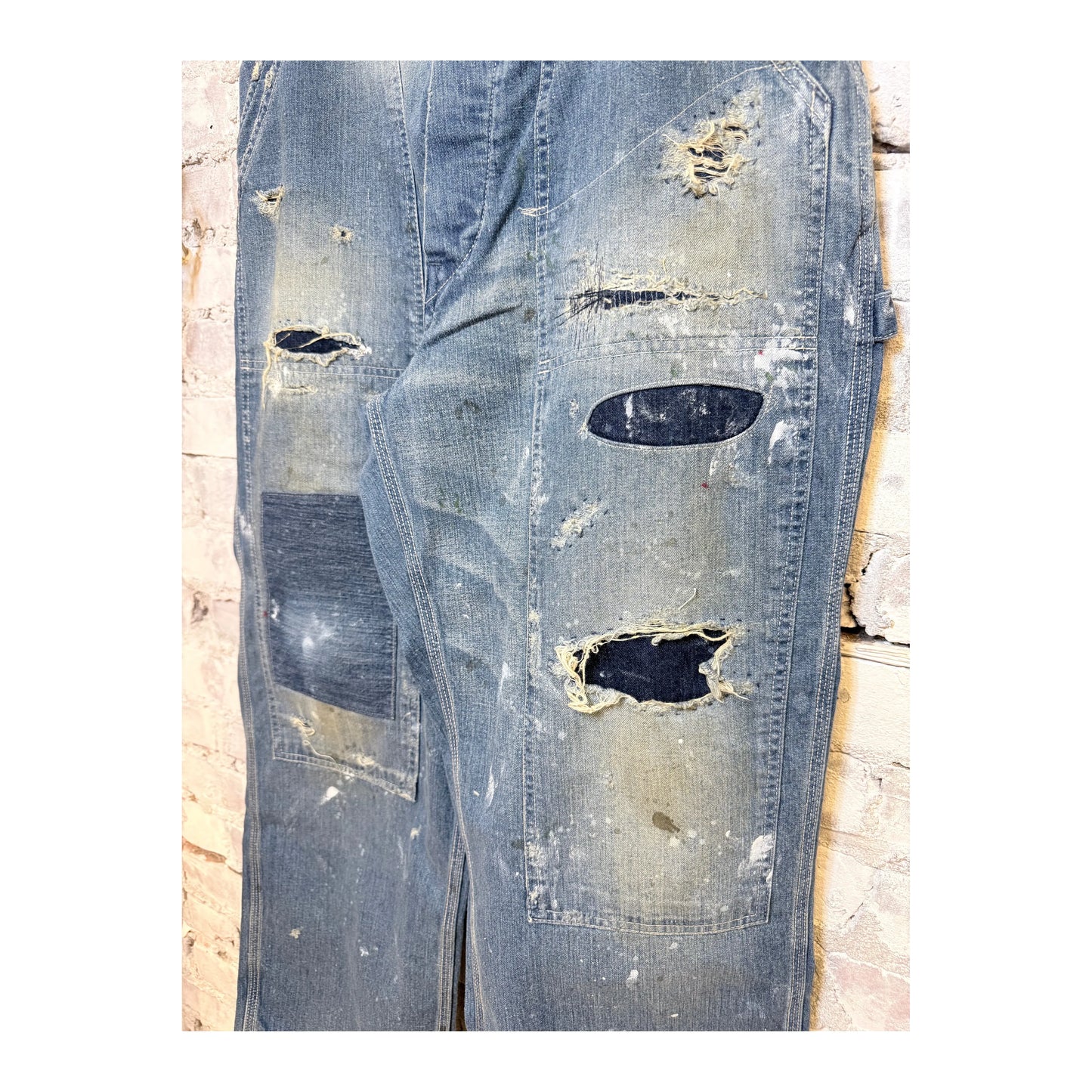 Men's customized side open Panther denim pants by H-Unit, featuring a stylish design and unique side openings.