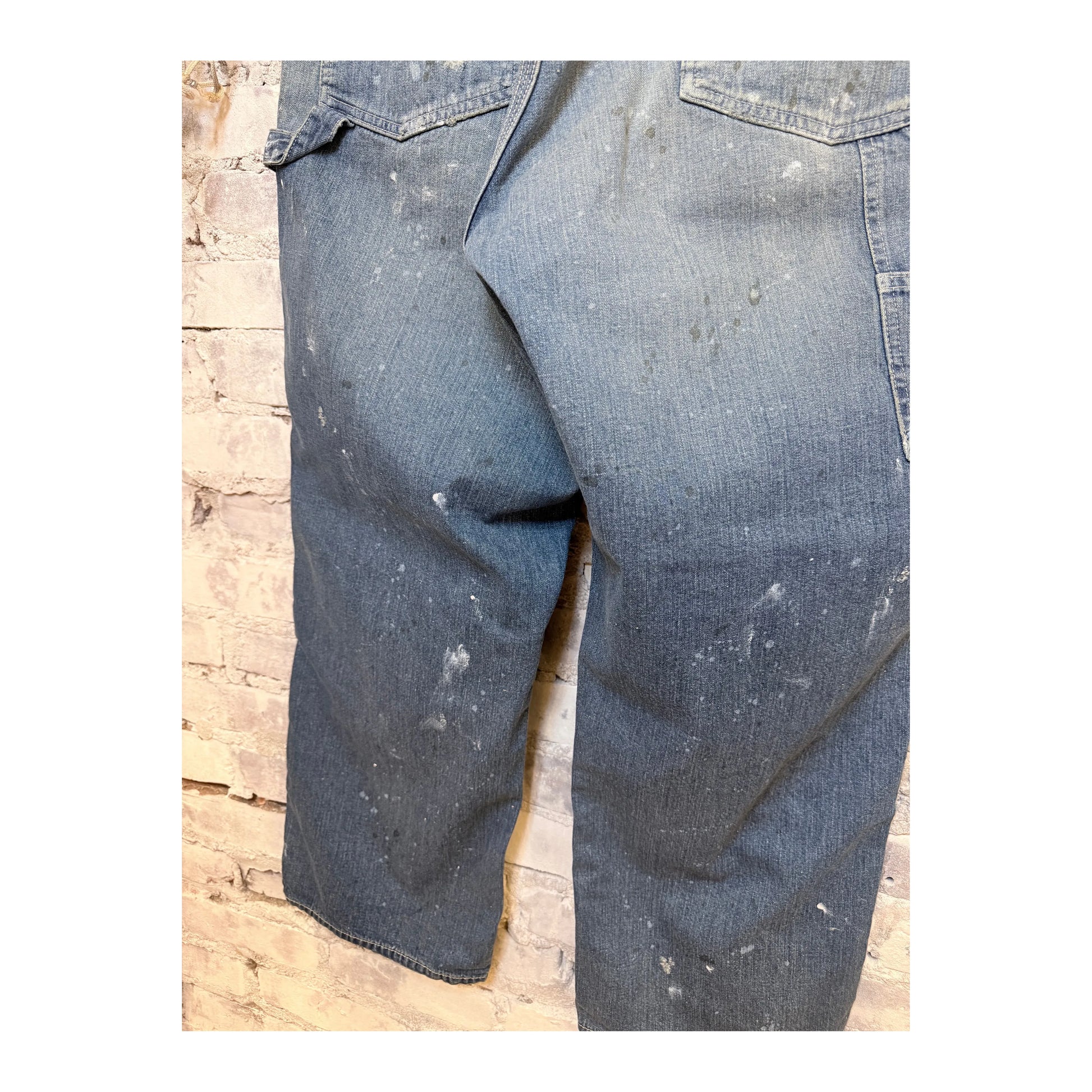 Men's customized side open Panther denim pants by H-Unit, featuring stylish design and unique side openings.