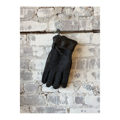 Men's Hestra Daniel Leather Gloves in charcoal and black, showing close-up of stylish, soft leather with detailed stitching.
