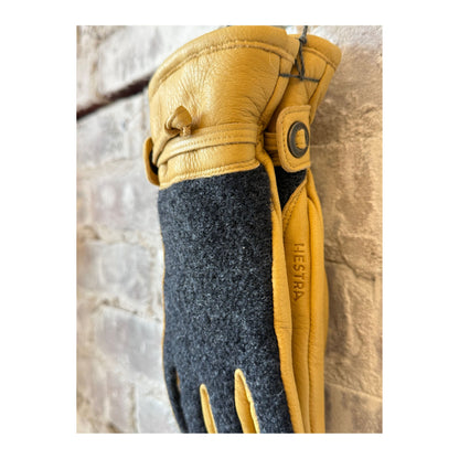 Men's Daniel Leather Gloves by Hestra in charcoal and tan, showcasing soft leather and detailed stitching.