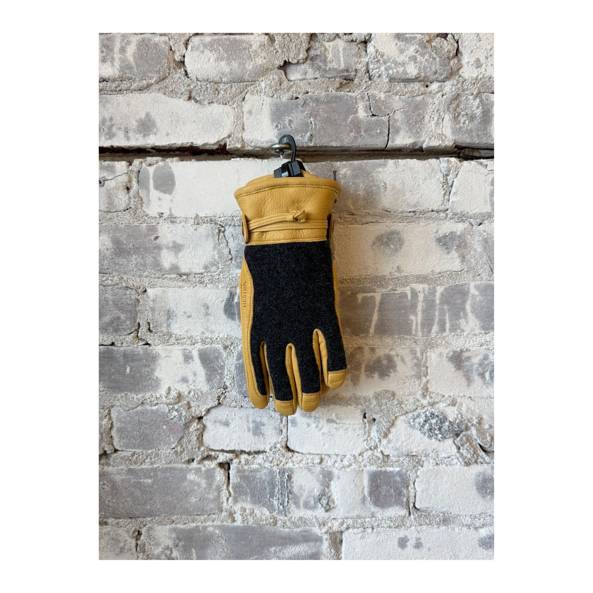 Hestra Daniel men's leather gloves in charcoal and tan, featuring soft leather and a stylish, fitted design.
