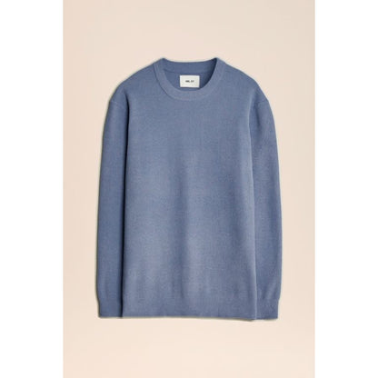 Men's NN07 Danny Sweater in stone blue, showcasing a cozy knit sweater with a round neckline and ribbed cuffs.