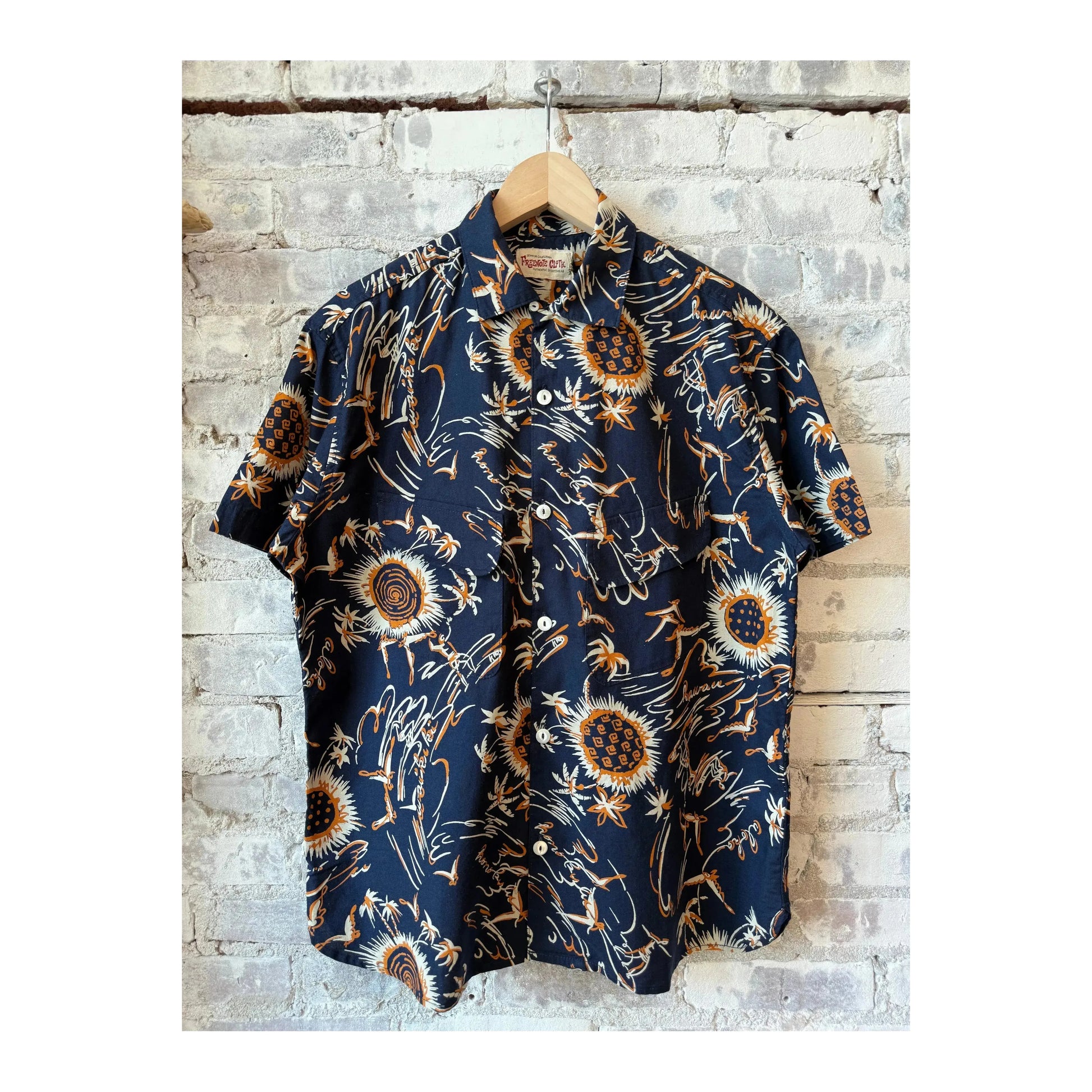 Men's Freenote Cloth Dean Double Pocket SS Shirt in Aloha Navy, with short sleeves and twin chest pockets, laid flat.