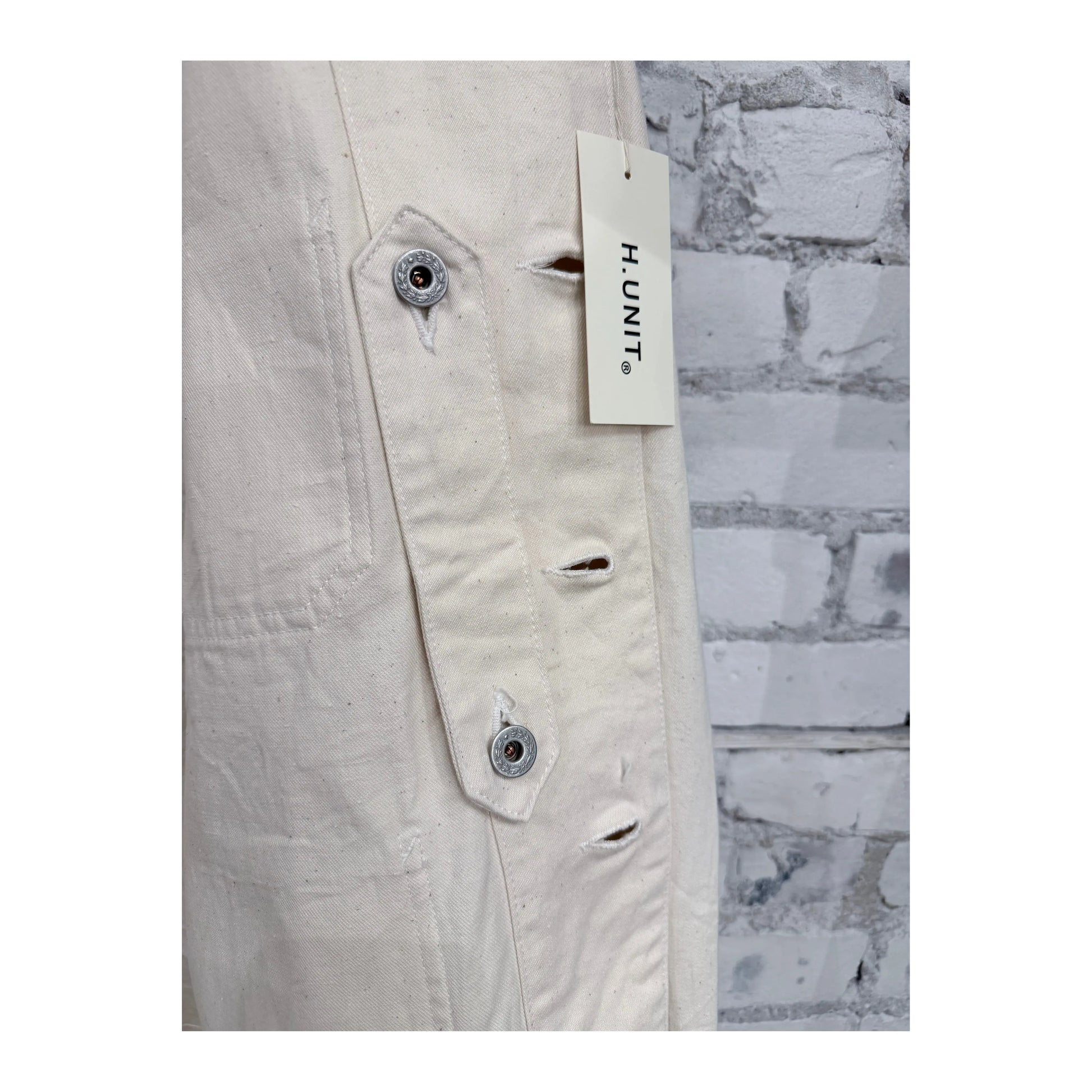 Men's denim one-wash coveralls by H-Unit, featuring a classic fit and functional pockets, displayed on a hanger.