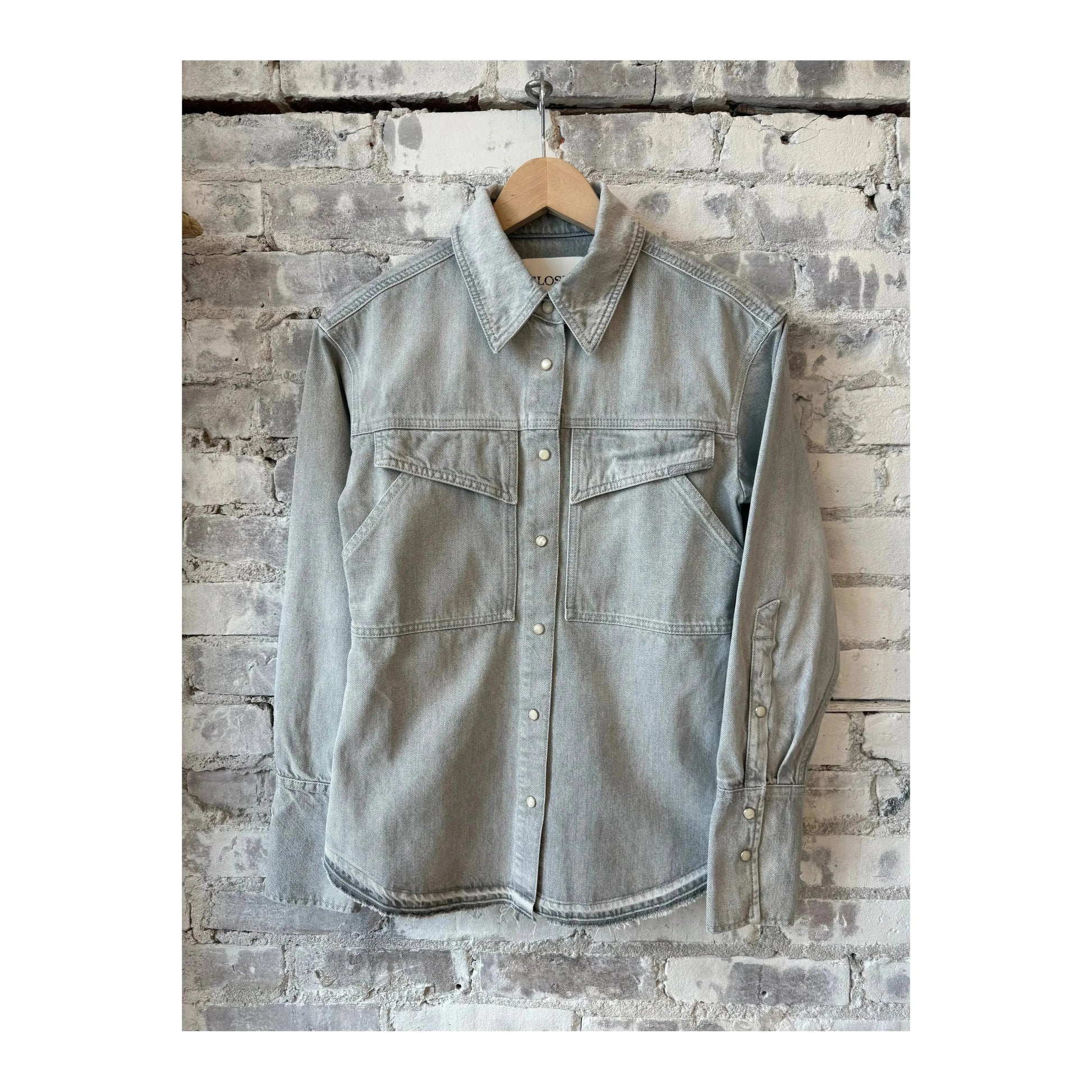 Light grey women's denim shirt by Closed, featuring classic button-down style and casual fit, shown on a model.