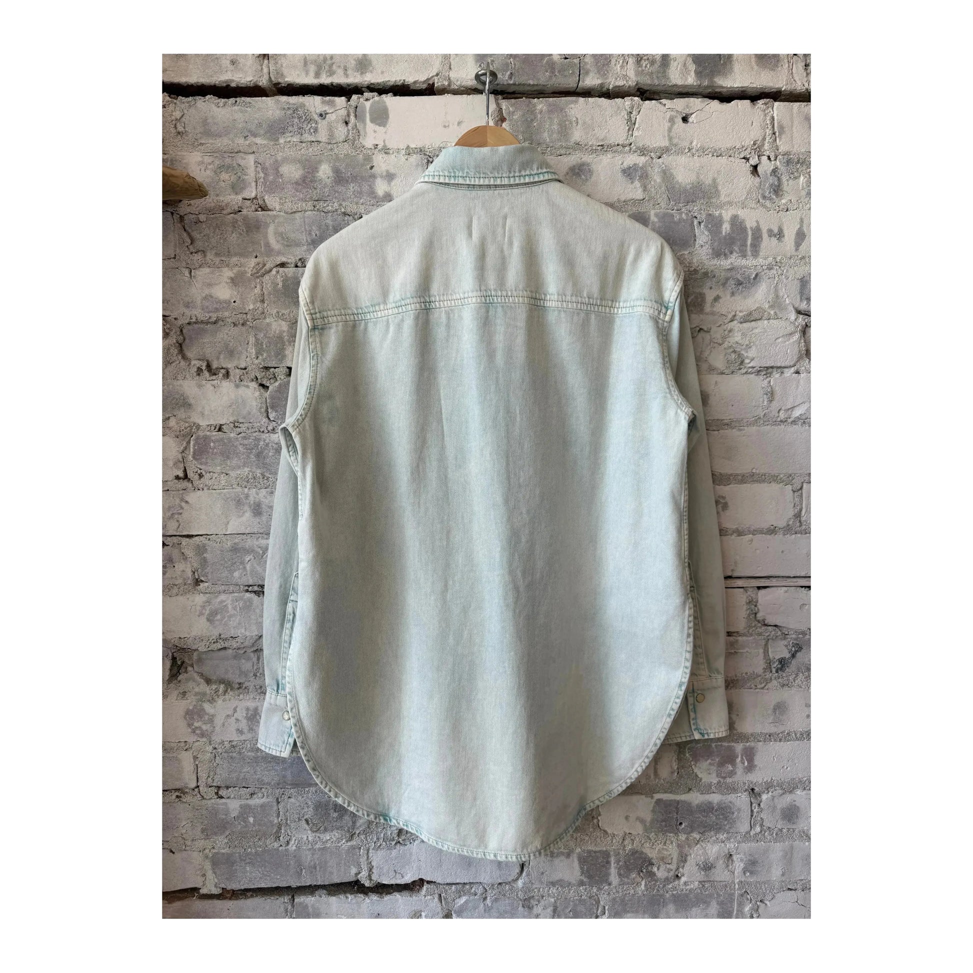 Women's washed out blue denim shirt by Closed Women's, featuring a classic button-up style and casual fit.
