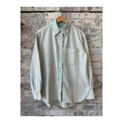 Women's washed out blue denim shirt by Closed Women's, showcasing the casual fit and classic button-front design.