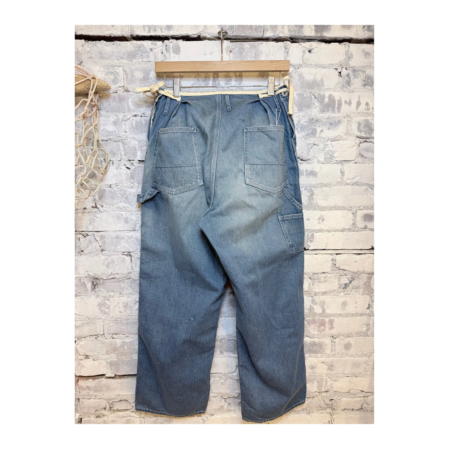 Men's H-Unit denim painter pants with side openings in a used wash, featuring a relaxed fit and functional pockets.