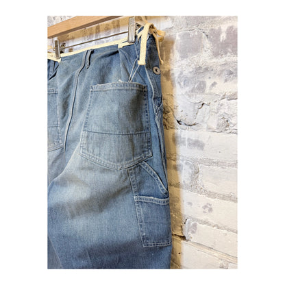 Men's denim painter pants by H-Unit with side opening, used wash, featuring functional pockets and durable workwear design.
