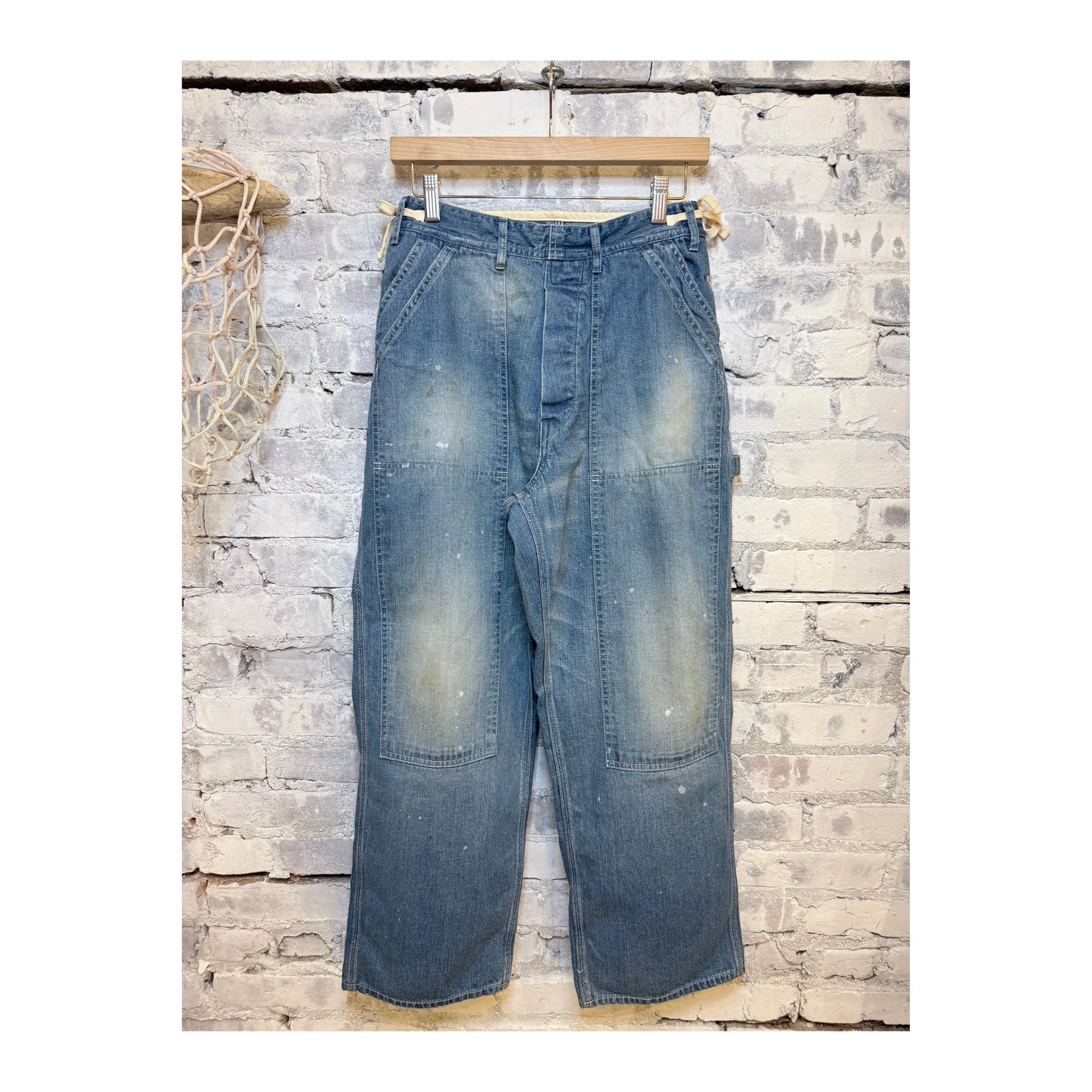 Men's denim painter pants by H-Unit with side open design and used wash finish, featuring a relaxed fit and functional pockets.