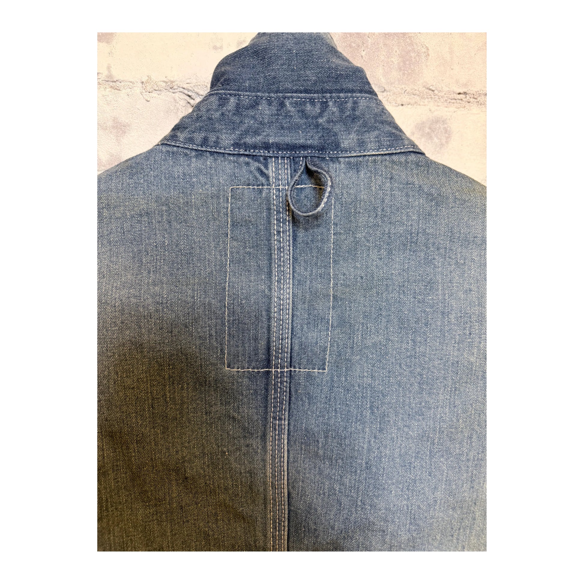 Men's used-wash denim coveralls in indigo by H-Unit, featuring a rugged workwear style with multiple pockets and a classic fit.