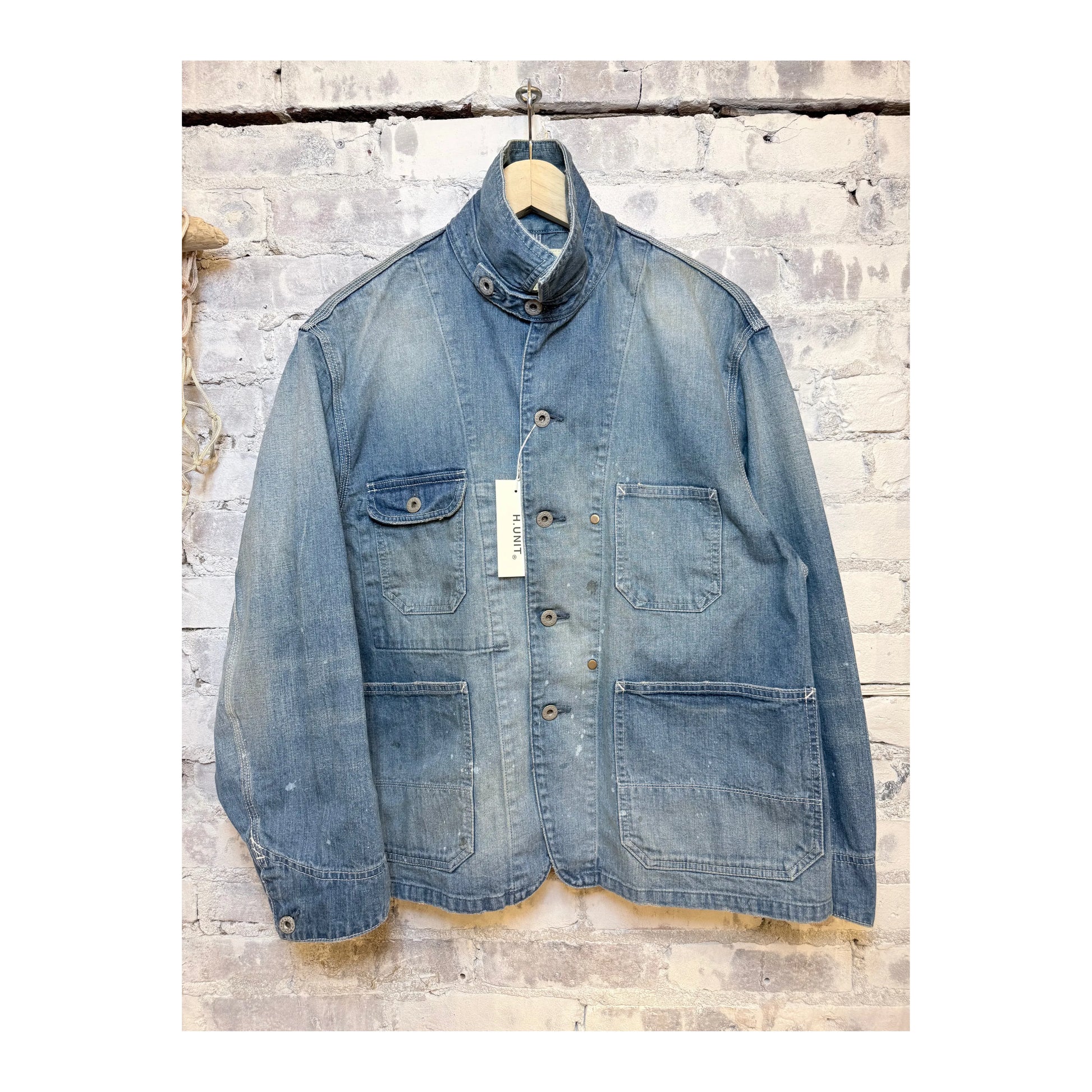 Men's used-wash indigo denim coveralls by H-Unit, featuring a rugged, casual fit with front pockets and durable fabric.