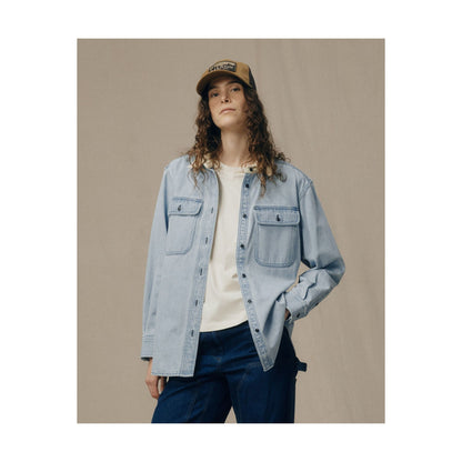 Women's light indigo denim work shirt by FILSON, featuring a casual fit with button-up front and long sleeves.