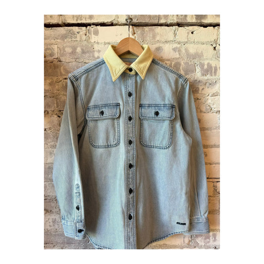 Light indigo women's denim work shirt by FILSON, featuring classic design and durable fabric for casual or workwear.
