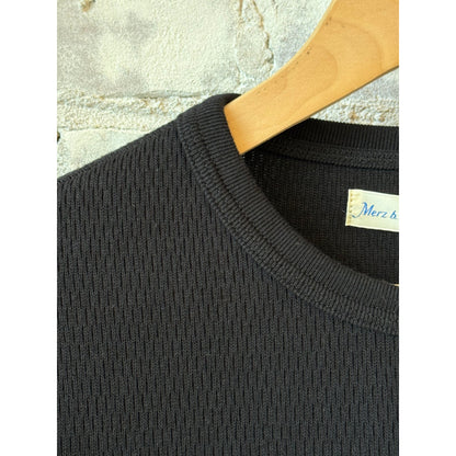Women's deep black cotton thermal longsleeve with diamond pattern by Merz b. Schwanen, featuring a cozy, textured design.