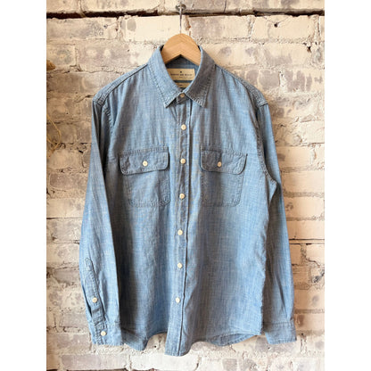 Men's Earl Chambray 2-Pocket Workshirt by imogene + willie in chambray blue, featuring button-up front and two chest pockets.