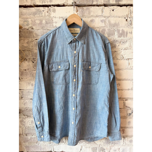 Men's Earl Chambray 2-Pocket Workshirt by imogene + willie in chambray blue, featuring button-up front and two chest pockets.