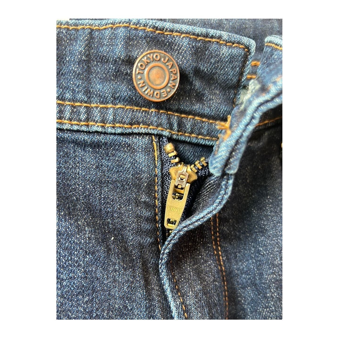 Men's Edwin Aomori Regular Tapered Denim jeans in dark indigo, showcasing the fitted tapered leg and classic denim texture.