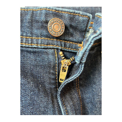 Men's Edwin Aomori Regular Tapered Denim jeans in dark indigo, showcasing the fitted tapered leg and classic denim texture.