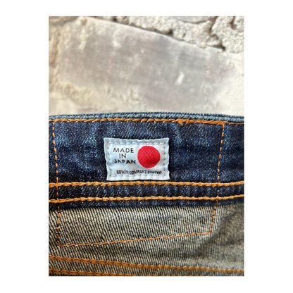 Men's Edwin Aomori Regular Tapered Denim jeans in deep indigo with visible stitching and classic five-pocket design.