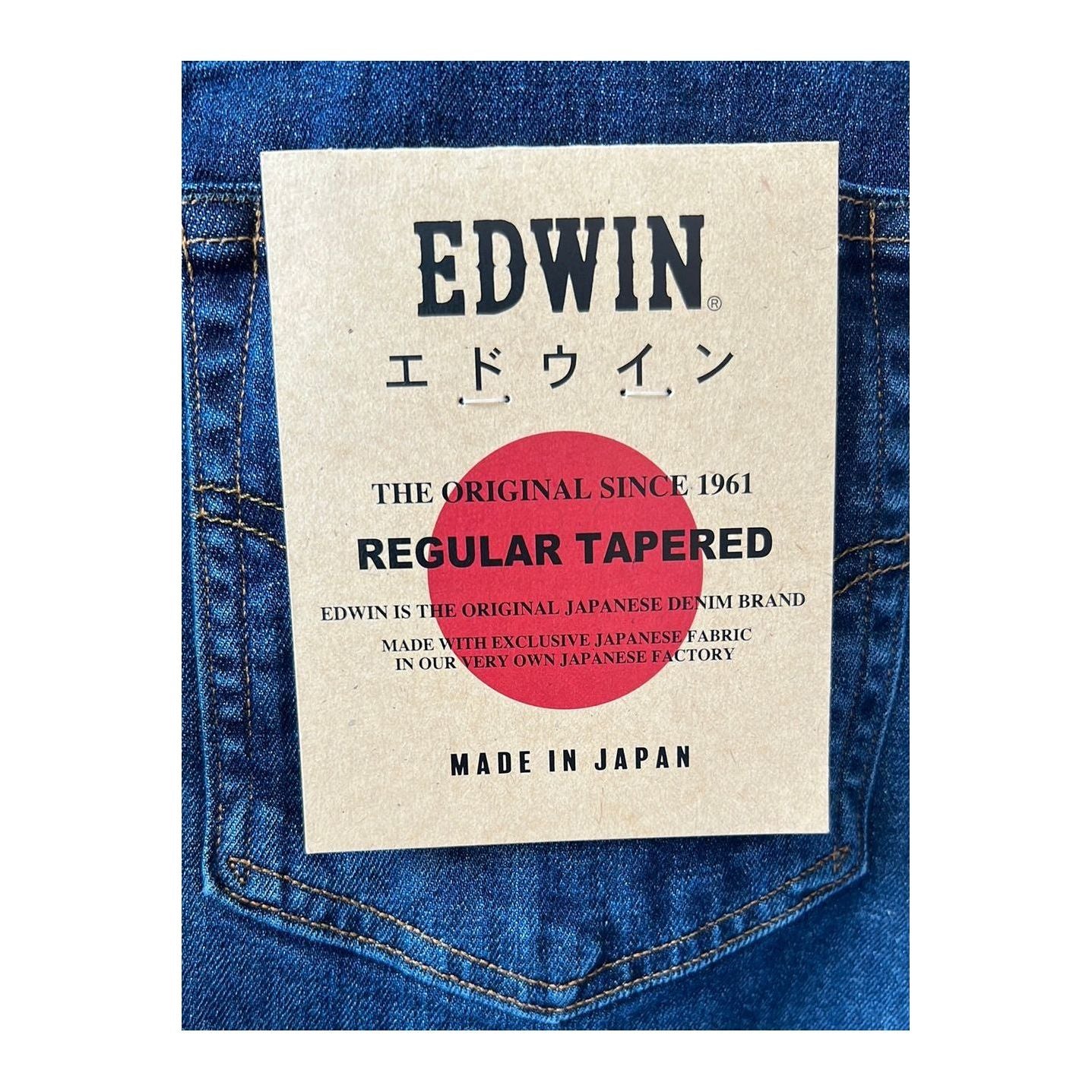 Men's Aomori Regular Tapered Denim jeans by Edwin, showcasing dark indigo color and classic tapered fit with subtle stitching details.