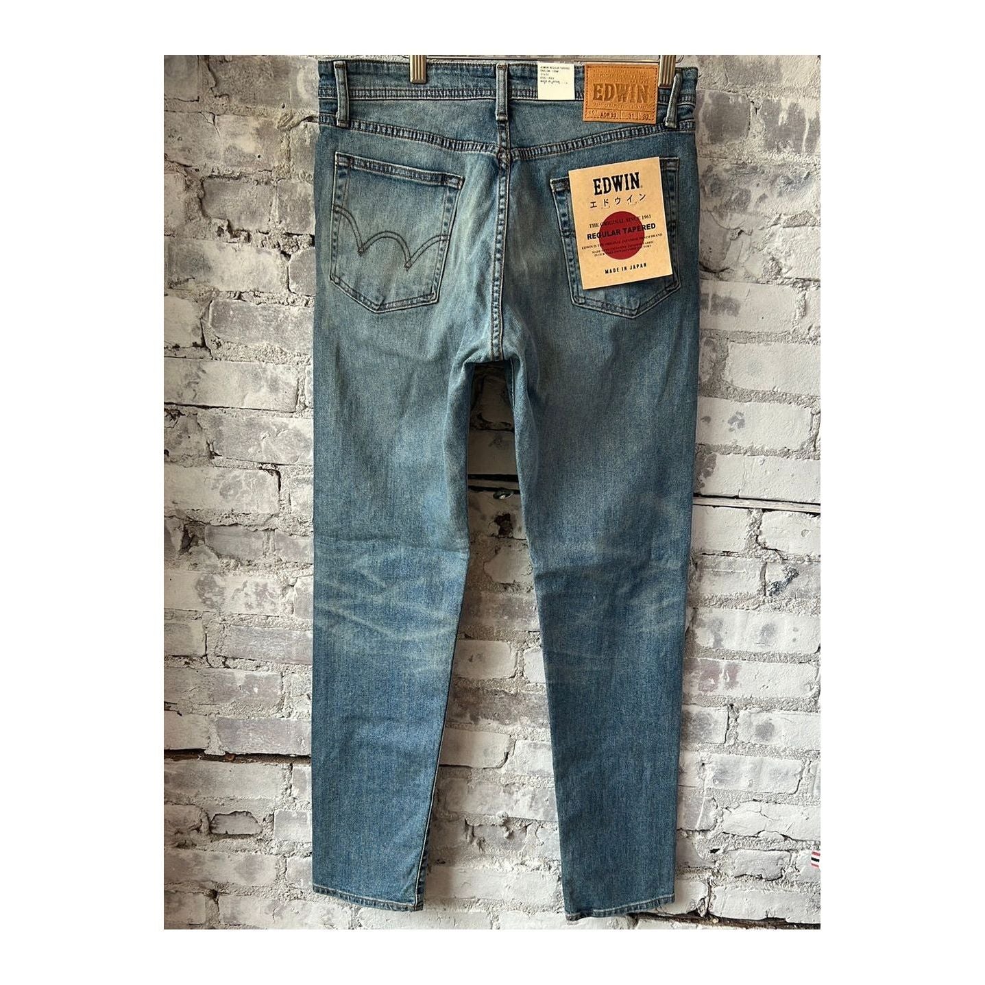 Men's Aomori Regular Tapered Denim by Edwin, showcasing dark indigo tapered jeans with subtle fading and classic five-pocket design.